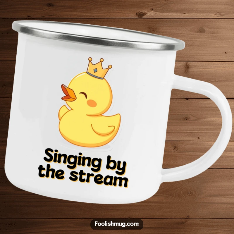 Funny singing rubber duck wearing a tiny crown, on a durable camping mug, for outdoor serenades.