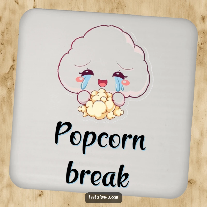 Funny drink coaster with a fluffy cloud character crying tears of joy that turn into popcorn, protecting surfaces with a touch of whimsical humor.