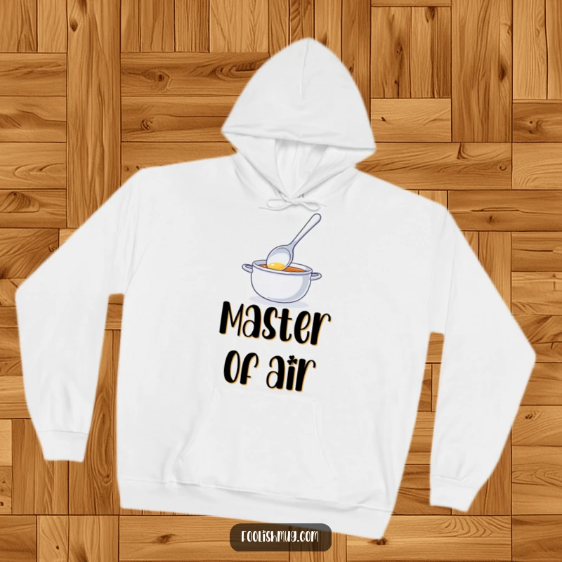 Funny hoodie featuring a shiny spoon character comically stirring invisible soup, offering warmth and a hilarious statement piece for humor lovers.
