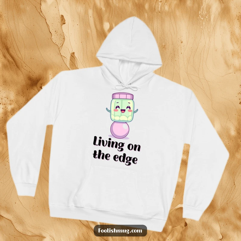 Funny wobbly jelly jar character balancing on a bouncing ball, featured on a cozy funny hoodie.