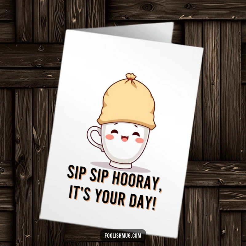 Funny free printable birthday card: a cute teacup character playfully wearing a giant teabag as a hat.