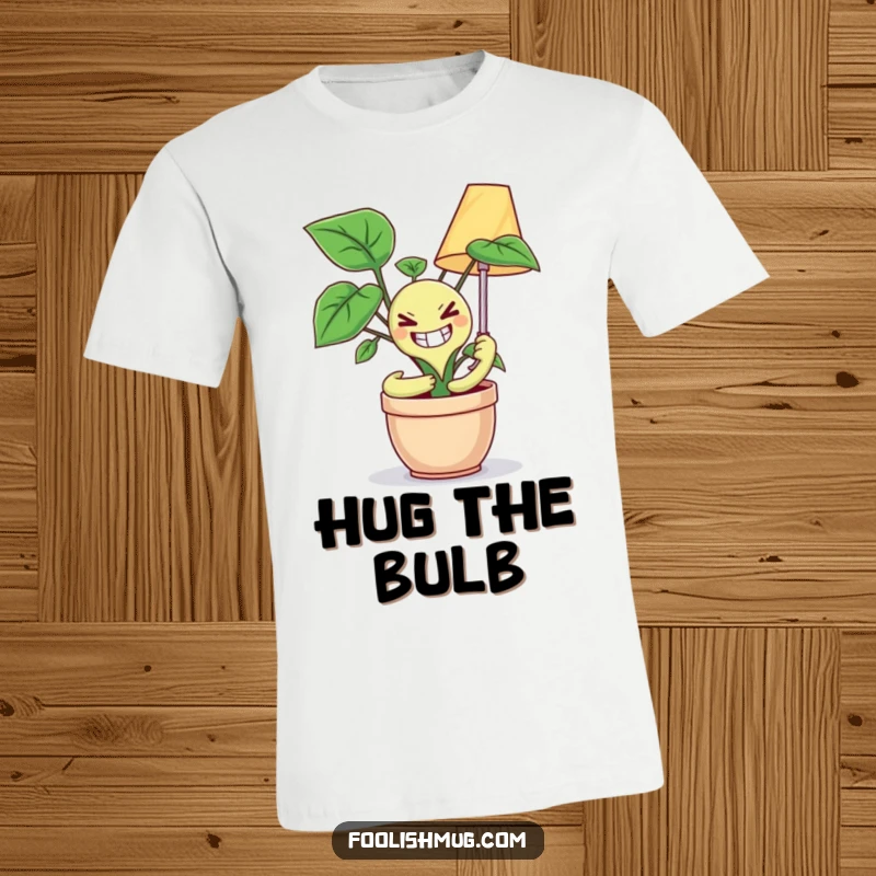 Funny t-shirt design of a potted plant with a crazed smile attempting to embrace a lamp, offering eccentric humor and a quirky statement.