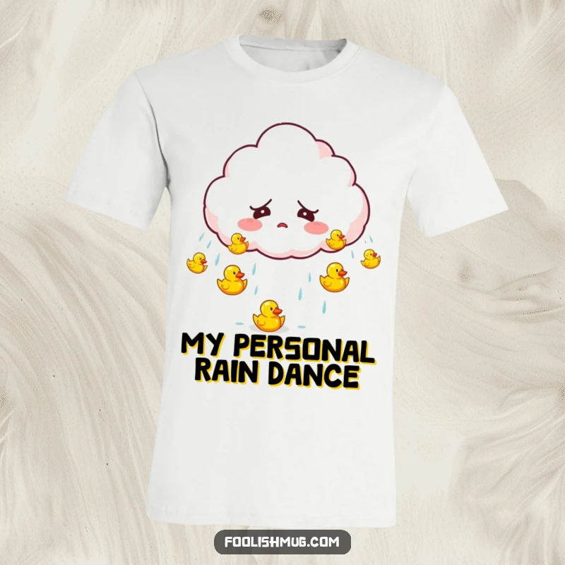 Funny startled cloud character accidentally raining tiny bouncing rubber ducks on a t-shirt, a comical and whimsical apparel item.