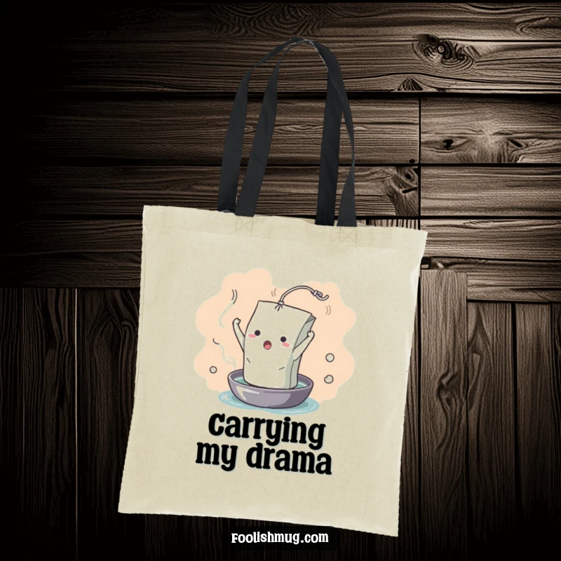 Funny Tote Bag: A dramatic teabag character captured mid-unfurl into hot water, symbolizing dramatic flair. A humorous and practical accessory.