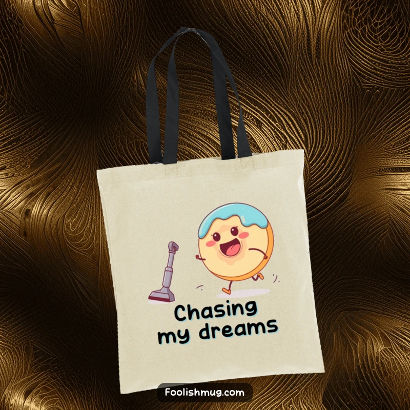 Funny donut character running from a miniature vacuum cleaner on a tote bag, illustrating a playful chase for everyday carry.