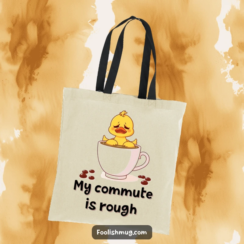 Funny tote bag with a rubber ducky trying to conquer a teacup of coffee, perfect for carrying essentials with a touch of morning humor.
