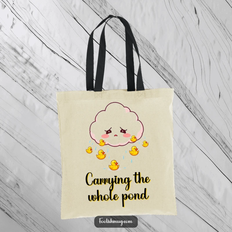 Funny startled cloud character accidentally raining tiny bouncing rubber ducks on a tote bag, a charming and humorous accessory.